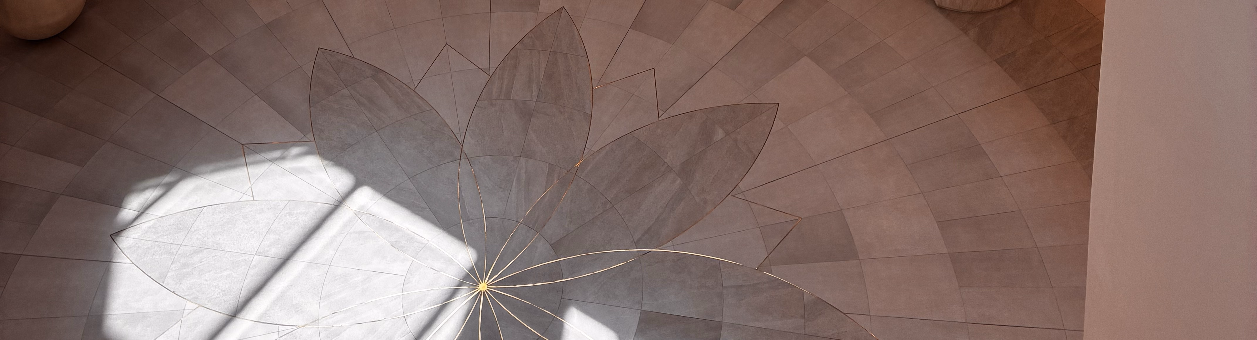 Sunlight falling through a window onto a tiled floor